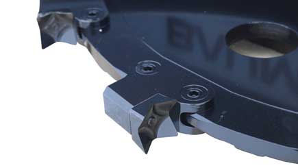 Baumalight DPH series PTO tree cutter with three-point hitch mounted on a New Holland tractor on white background