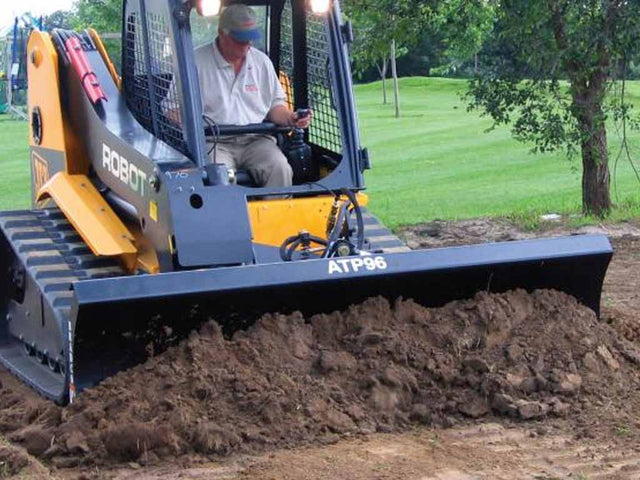 Paladin 6-Way Dozer Blade for skid steers with hydraulic angle and tilt control for precision grading and material pushing