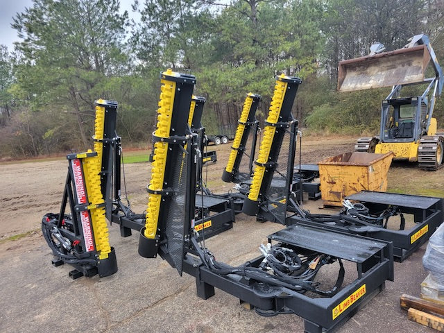 Limb Beaver LB6SS brush cutter mounted on a skid steer clearing thick brush and vegetation