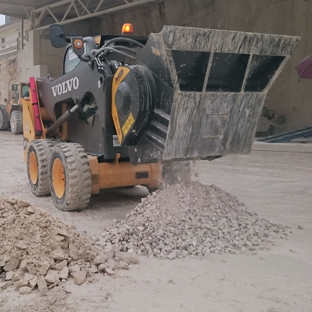 MB-L120 construction vehicle unloading rocks on a construction site