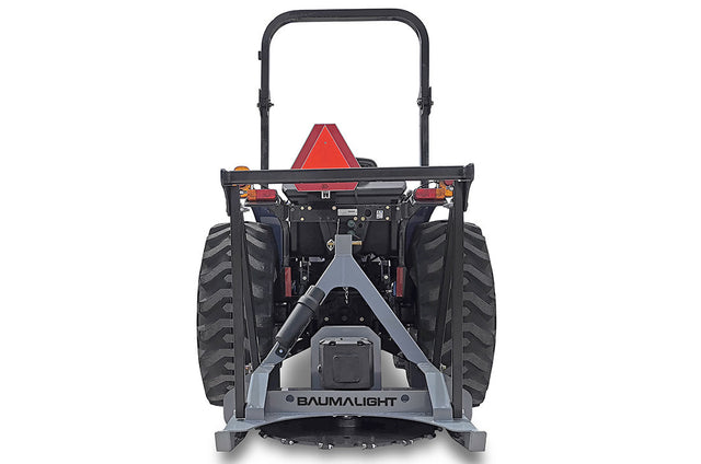 Baumalight DPH series PTO tree cutter with three-point hitch mounted on a New Holland tractor on white background