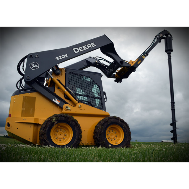 Digga 1DSS auger drive with universal skid steer quick-attach mount plate and hydraulic hoses on field background