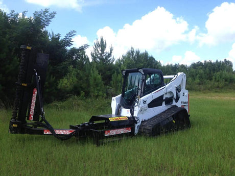 Limb Beaver LB6SS brush cutter mounted on a skid steer clearing thick brush and vegetation