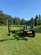 Limb Beaver BB4HP Baby Beaver brush cutter with yellow sickle bar mounted on a John Deere tractor in an open field