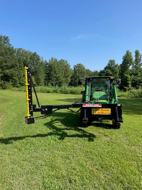Limb Beaver BB4HP Baby Beaver brush cutter with yellow sickle bar mounted on a John Deere tractor in an open field
