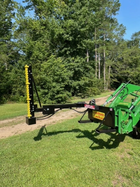 Limb Beaver BB4HP Baby Beaver brush cutter with yellow sickle bar mounted on a John Deere tractor in an open field