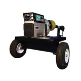 A Baumalight TX7 - 7 kW Tractor PTO Generator with a green and black color scheme, featuring large wheels, and mounted on a trailer.