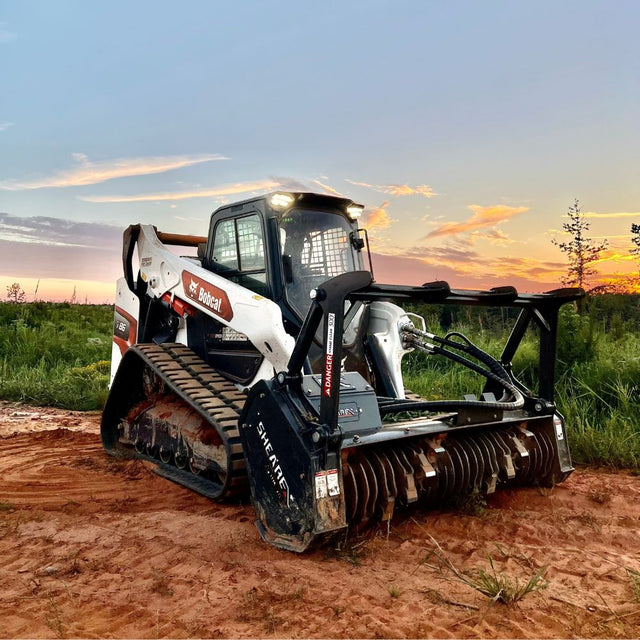 Shearex HM-Series Skid Steer Mulching Head for grinding brush trees and stumps into fine mulch during land clearing operations