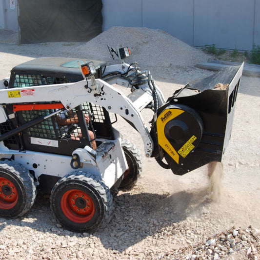 Bobcat MB-L140 Skid steer loader with a stump grinder attachment in an outdoor setting.