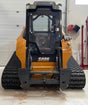 A CASE Alpha Series Skid Steer with a clear polycarbonate door installed on it, meant for replacement or retrofit on skid steer models without a factory door.