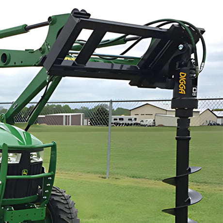 Digga DDD direct drive auger with slide frame mount attached to a John Deere tractor front loader with auger bit ready for drilling