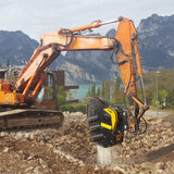 Hitachi-EX235A Excavator operating on a construction site with mountains and water in the background