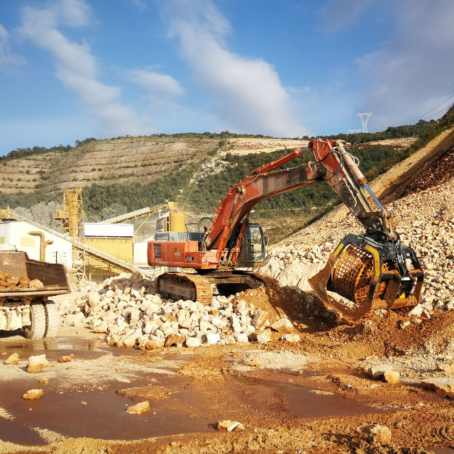 Hitachi-Zaxis-460 Excavator operating in a construction site with mountains in the background