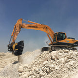 Hyundai BF90.3 excavator working on a pile of rocks with a clear blue sky in the background