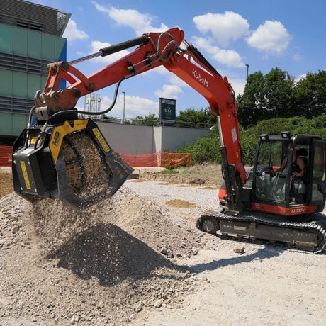 Kubota-KX080 excavator working on a construction site with a clear sky in the background