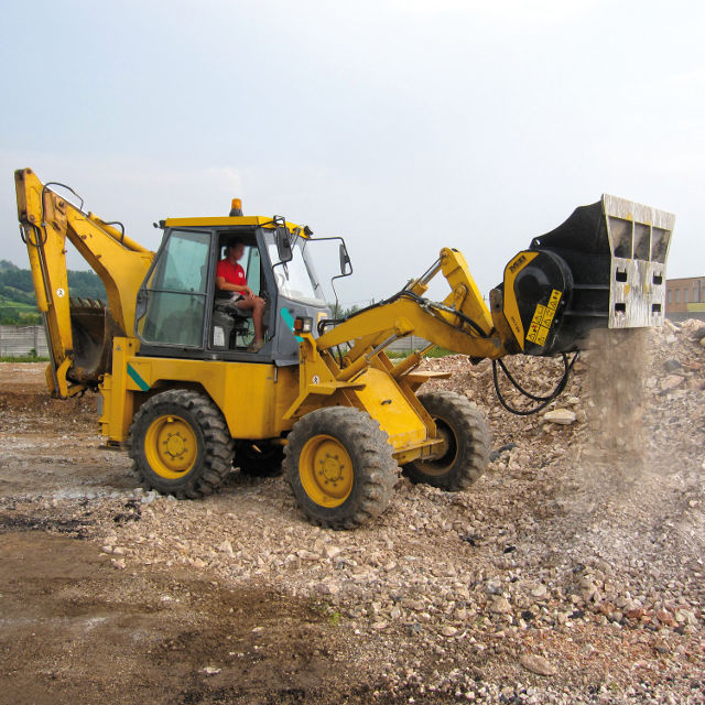 MB-L160-on-backhoe-loader operating on a construction site with a clear sky.