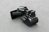 Blue Diamond mini skid steer backhoe attachment with hydraulic cylinder and toothed digging bucket on white background