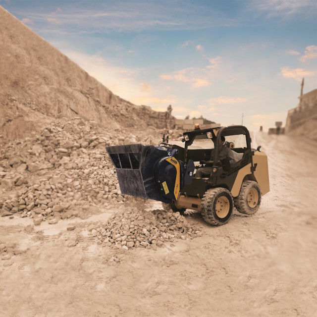 Volvo MB-L120 operating on a construction site with a clear sky.