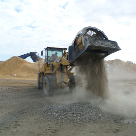 MB-LS170 vehicle dumping gravel on a construction site with a clear sky.