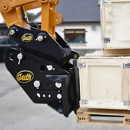 Black and yellow claw-like mechanical arm with 'Geith' branding on a blurred background of wooden crates.
