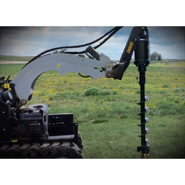 Digga 1DSS auger drive with universal skid steer quick-attach mount plate and hydraulic hoses on a field background