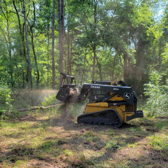 Shearex HM-Series Skid Steer Mulching Head for grinding brush trees and stumps into fine mulch during land clearing operations