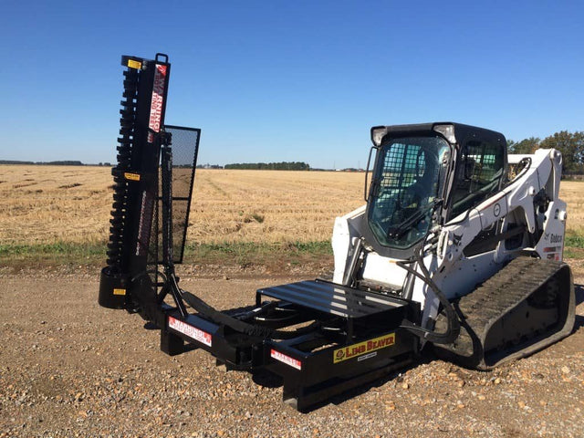 Limb Beaver LB6SS brush cutter mounted on a skid steer clearing thick brush and vegetation